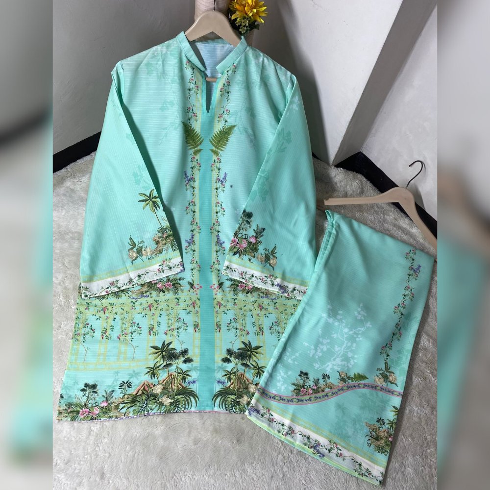 Light blue traditional outfit with floral patterns on a hanger against a neutral background