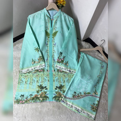 Light blue traditional outfit with floral patterns on a hanger against a neutral background