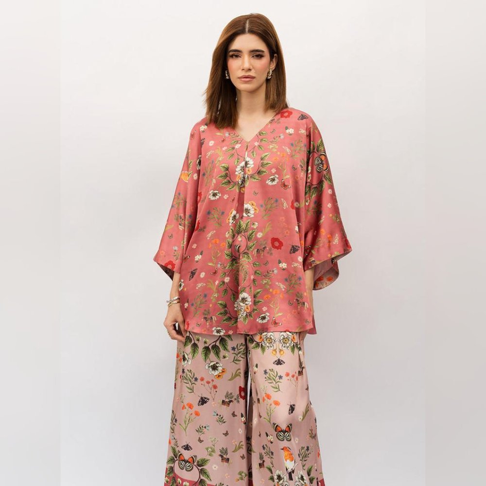 Woman wearing a floral outfit on a white background