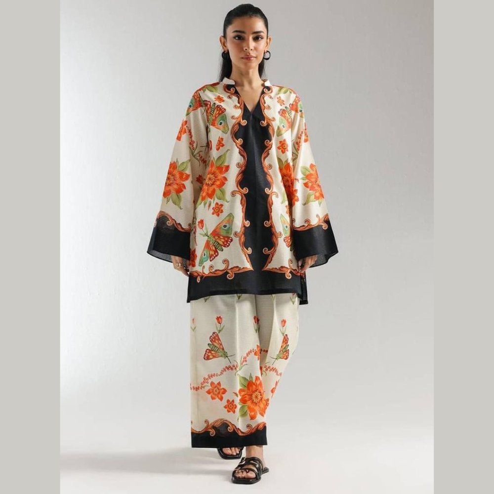 Woman wearing a floral outfit with a white background