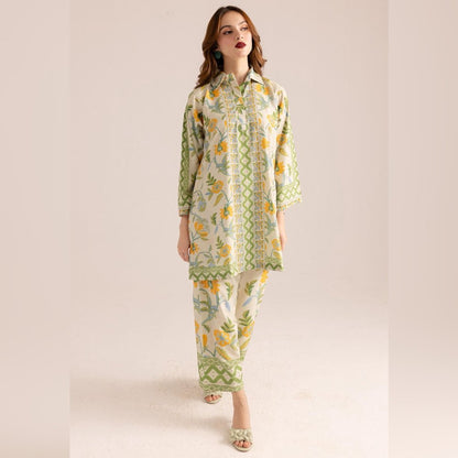 Woman wearing a floral outfit with green and yellow patterns on a beige background