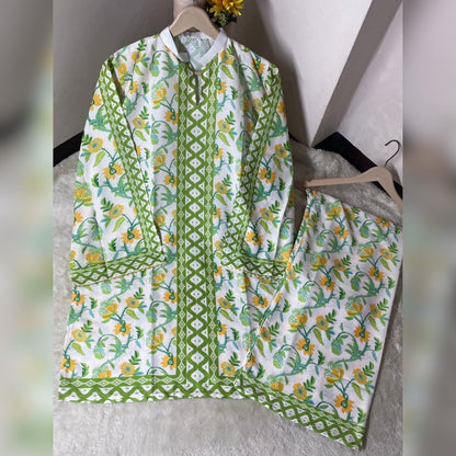 Floral and geometric patterned outfit on a hanger against a neutral background