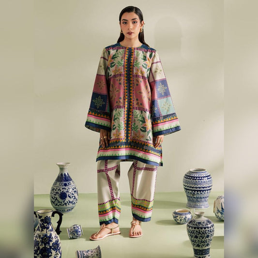 Woman wearing a colorful traditional outfit with decorative vases in the background