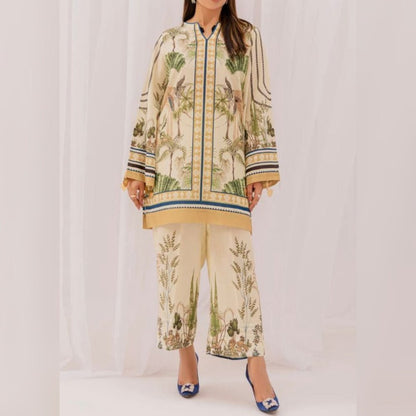 Woman wearing a floral printed outfit on a white background