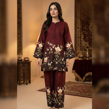 Woman wearing a maroon floral outfit in an ornate room.