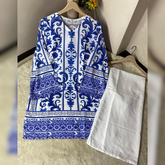 Blue and white patterned shirt on a hanger against a neutral wall.
