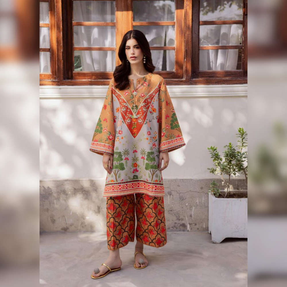 Woman wearing a traditional outfit with floral patterns in an outdoor setting.
