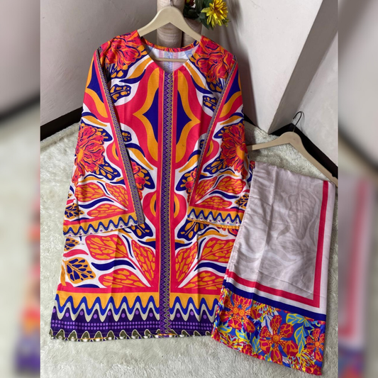 Colorful patterned jacket and skirt set on hangers against a neutral background