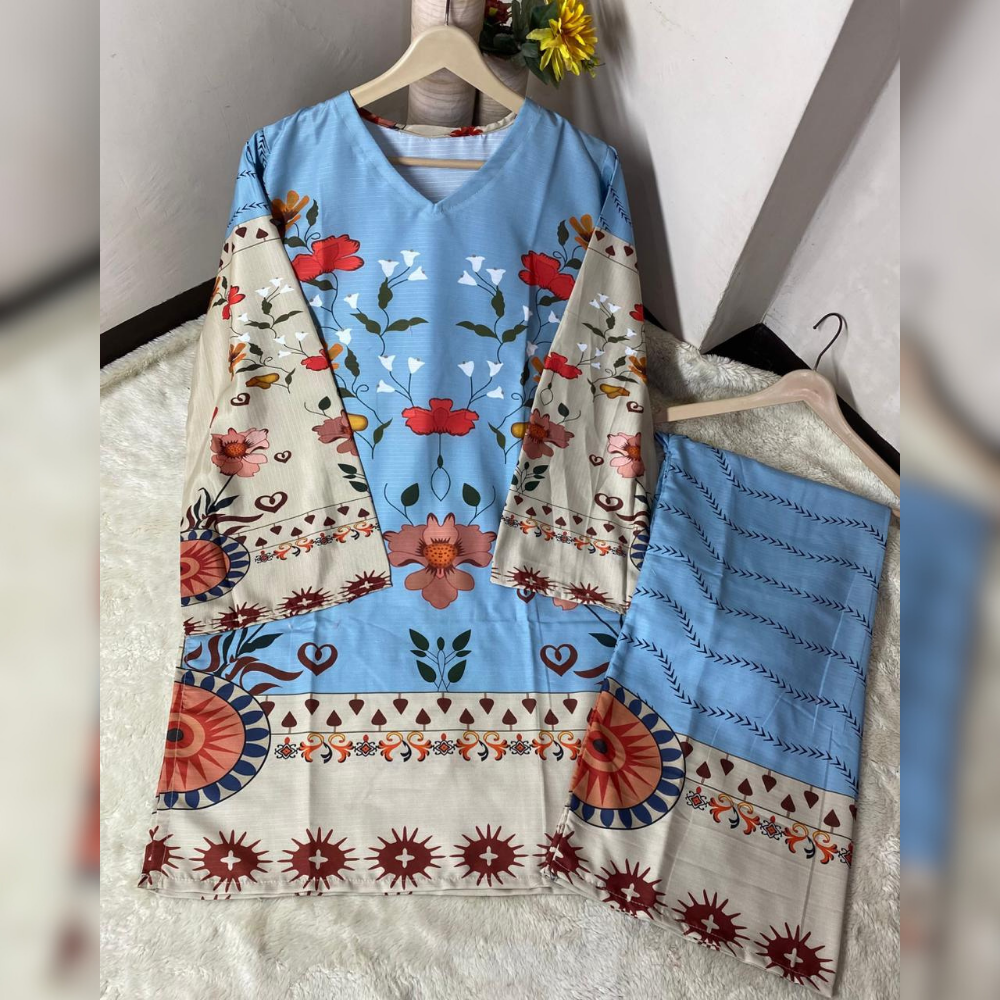 Traditional outfit with floral patterns on a hanger against a neutral background