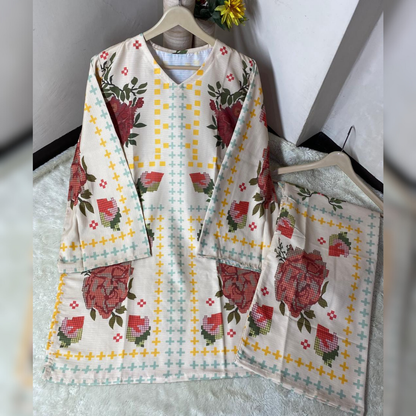 Floral patterned fabric on hangers against a white wall