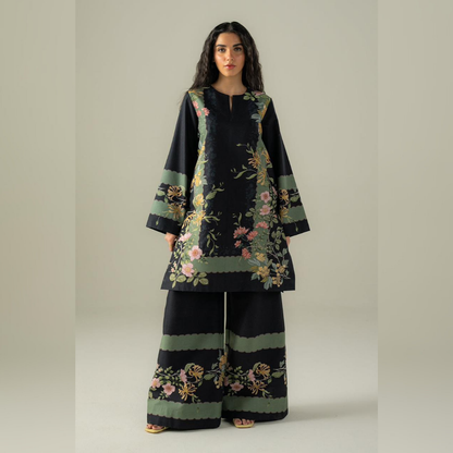 Woman wearing a black floral outfit on a beige background