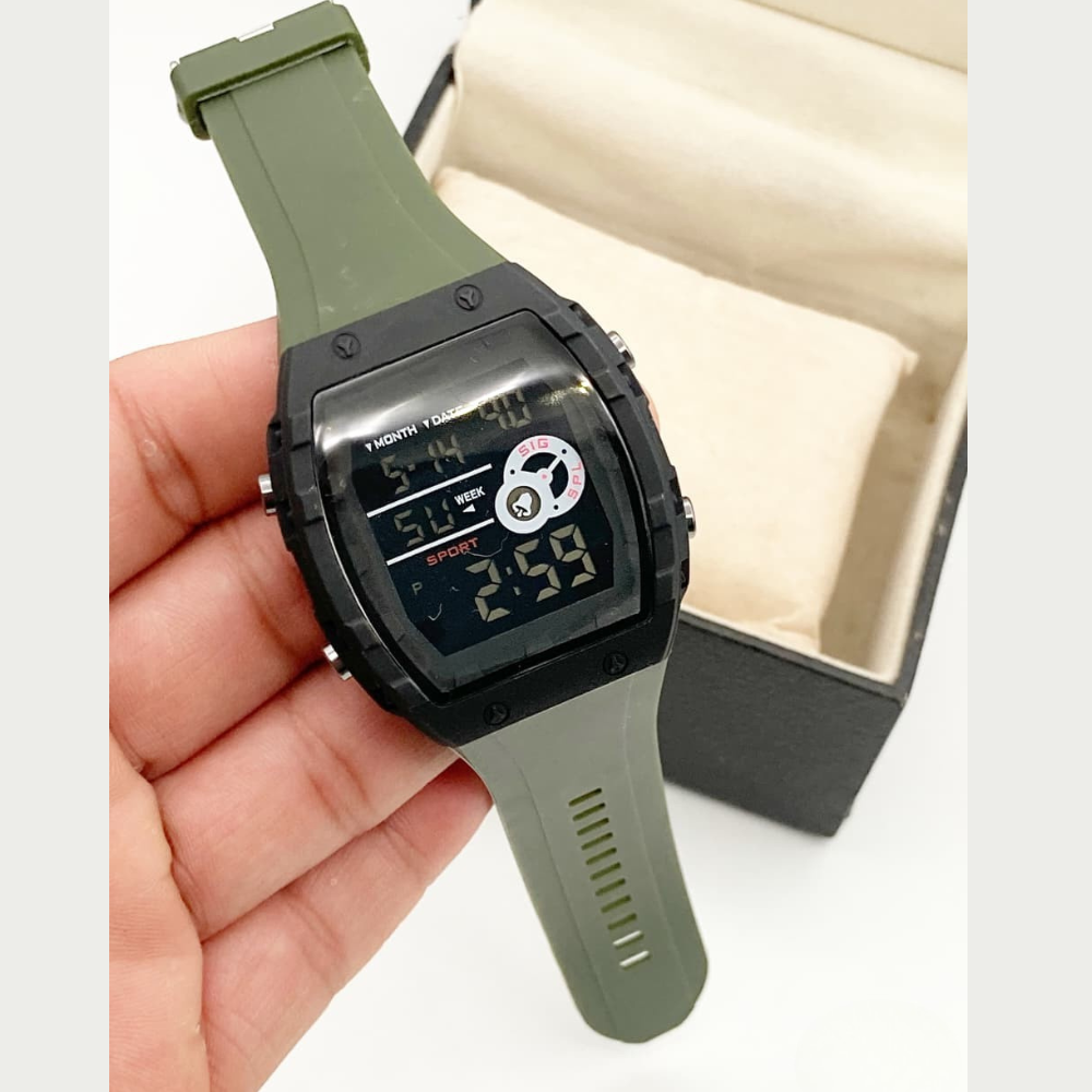 Digital watch with green strap held in a hand, with a white background