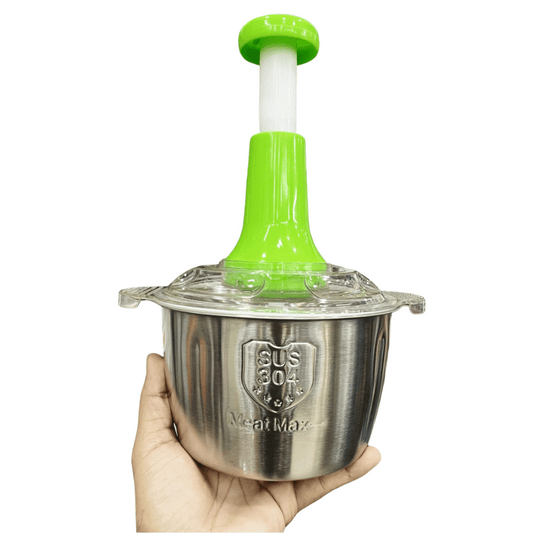 Hand holding a stainless steel meat tenderizer with green handle on a white background