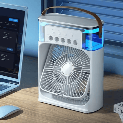 Portable air purifier on a desk next to a laptop