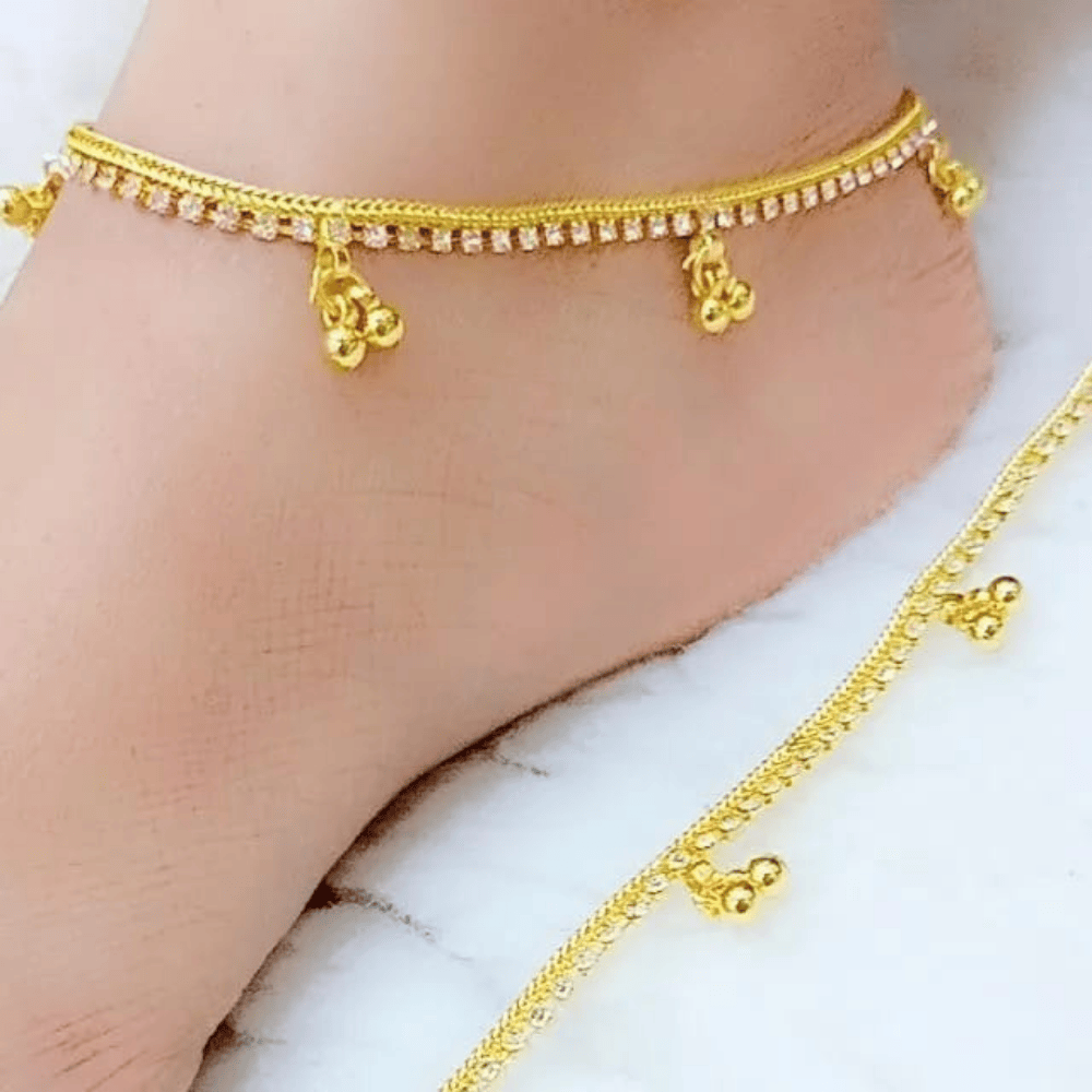 Front side close view of gold plated anklet on right leg
