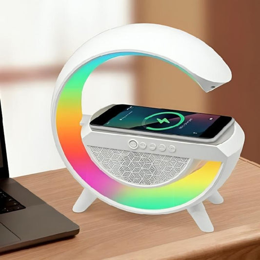White lamp with colorful base and smartphone on a wooden surface