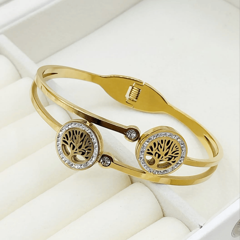 Gold bangle with detailed stone embellishments along the edges
