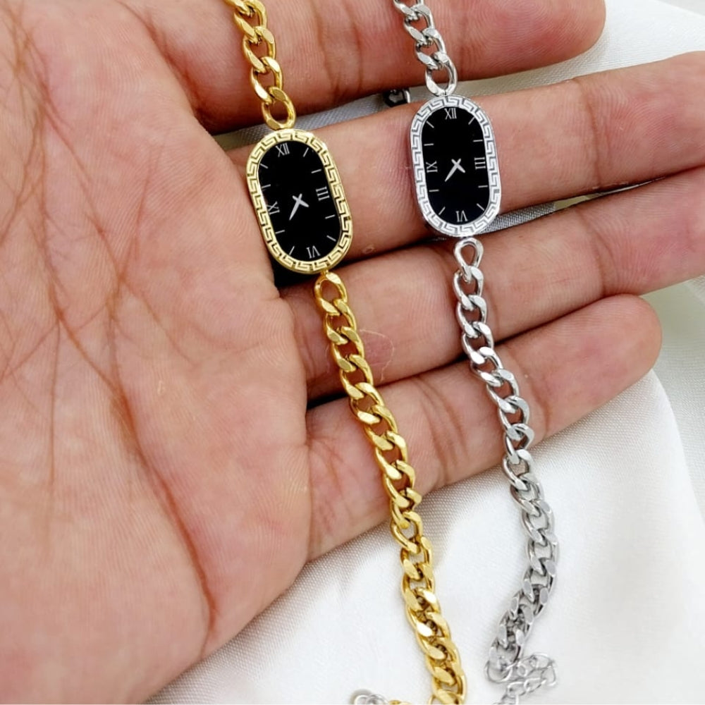 Two chain necklaces, one gold and one silver, held against a hand.