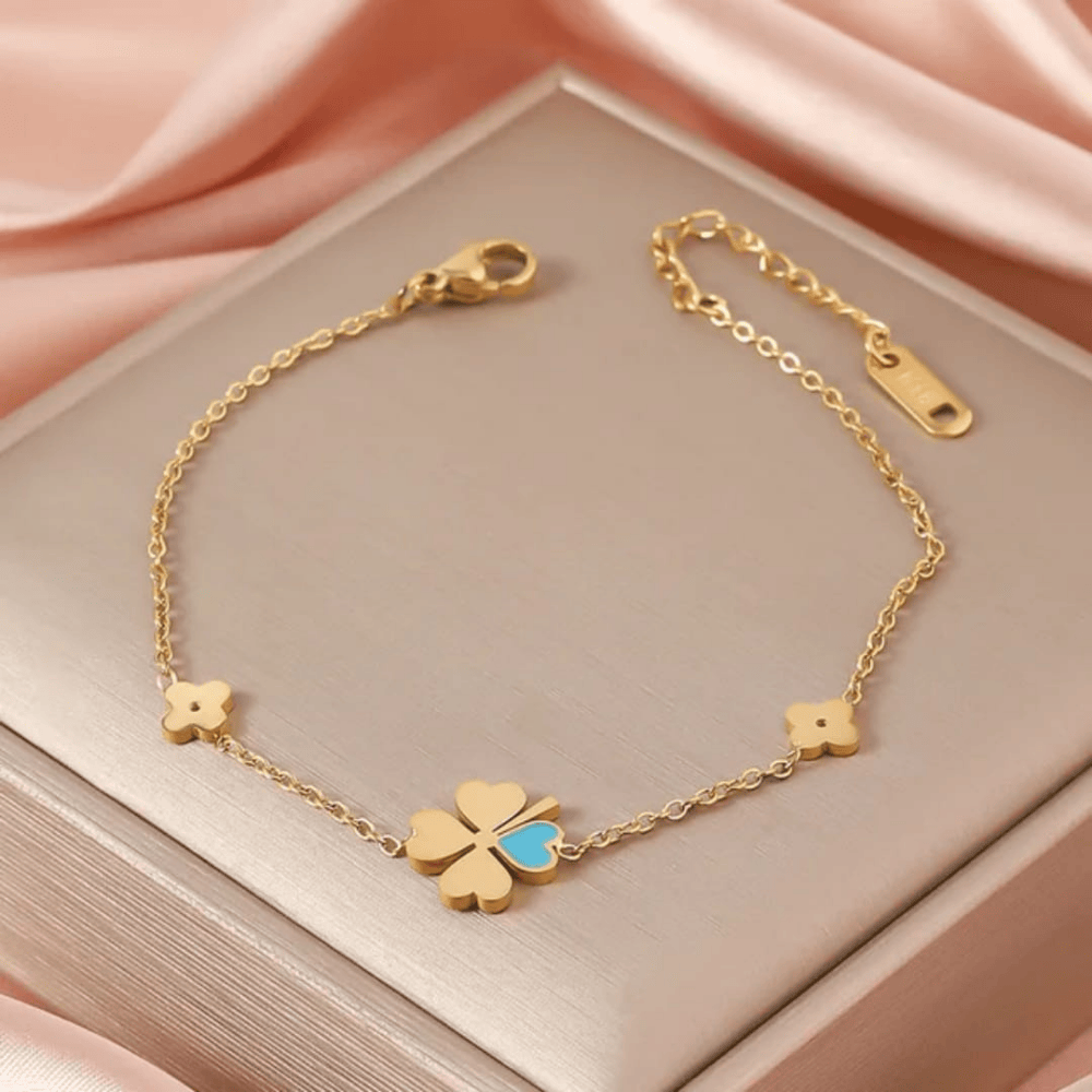 Elegant gold bracelet displayed on top of box – front view