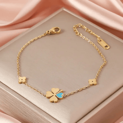 Elegant gold bracelet displayed on top of box – front view