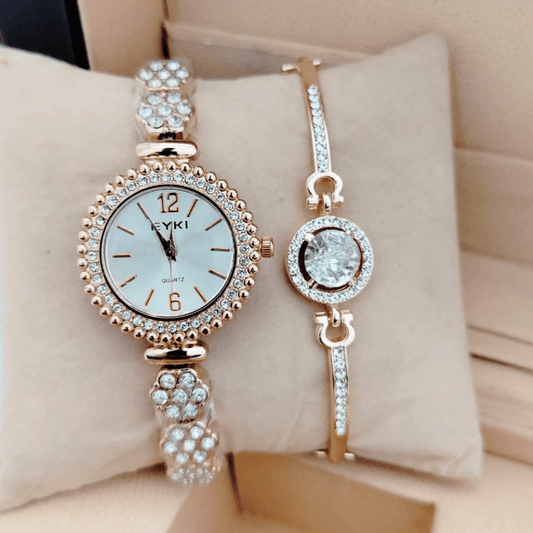 gold ladies watch with crystal bracelet on cushion display