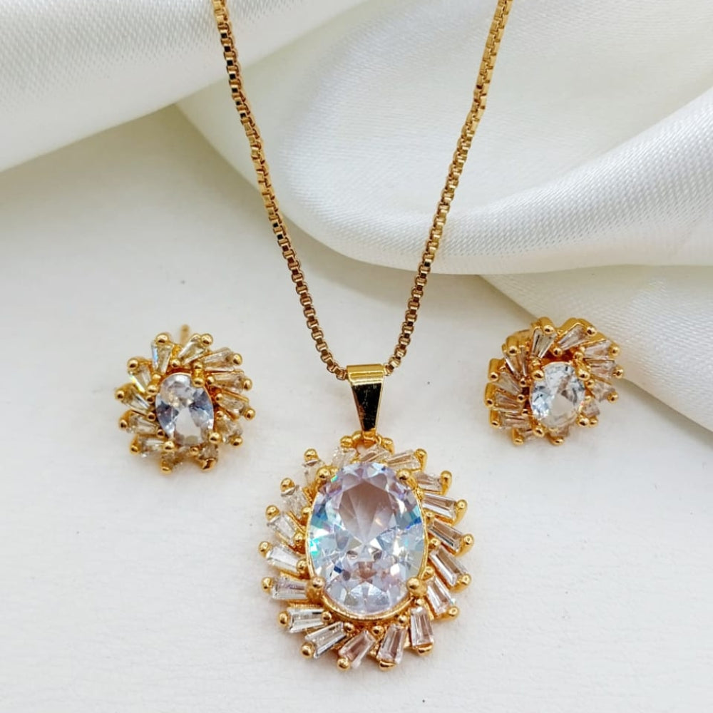 Gold jewelry set with pendant and earrings on a white background