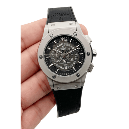 Hublot date watch with silver dial and black strap