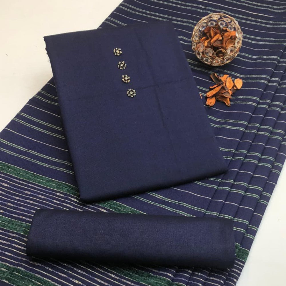 Navy fabric with decorative buttons on a striped fabric background