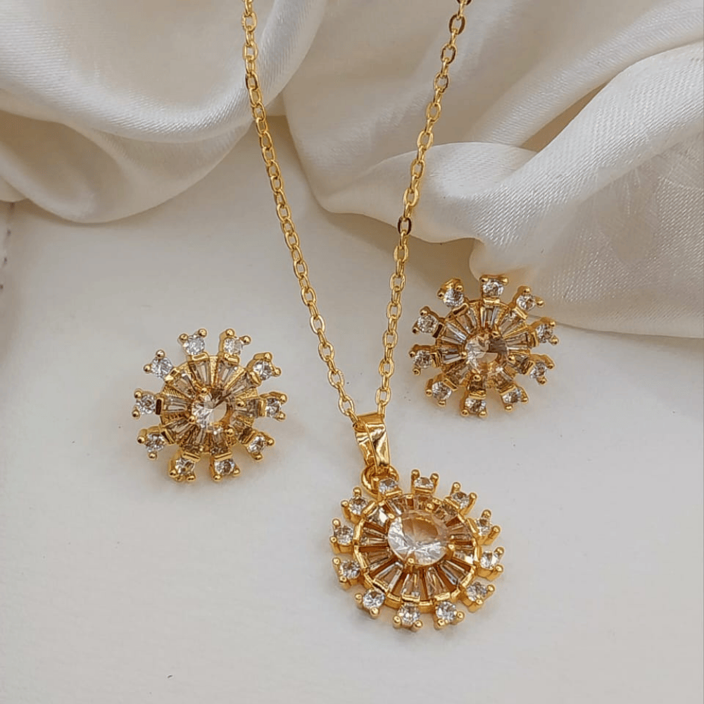Light silver-toned round locket with matching earrings, front view