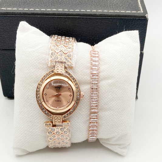 Rose gold watch and bracelet set on a white cushion with a black box in the background