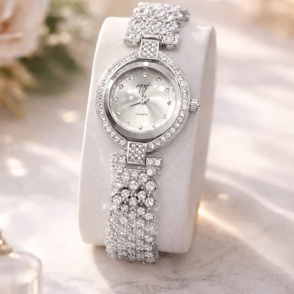 Silver wristwatch with floral design on a white background