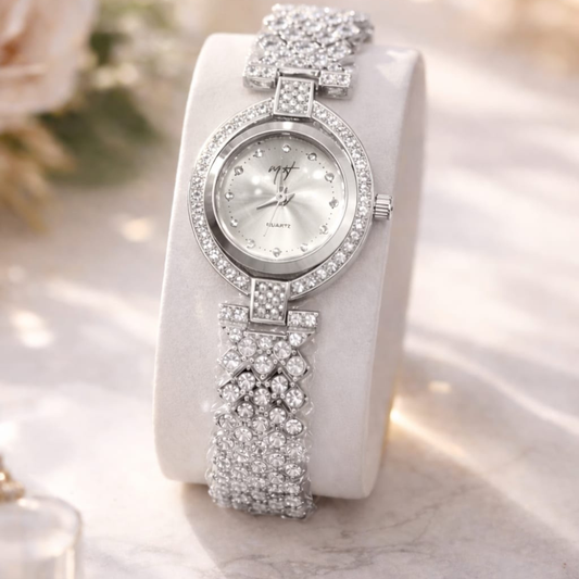 Silver wristwatch with floral design on a white background