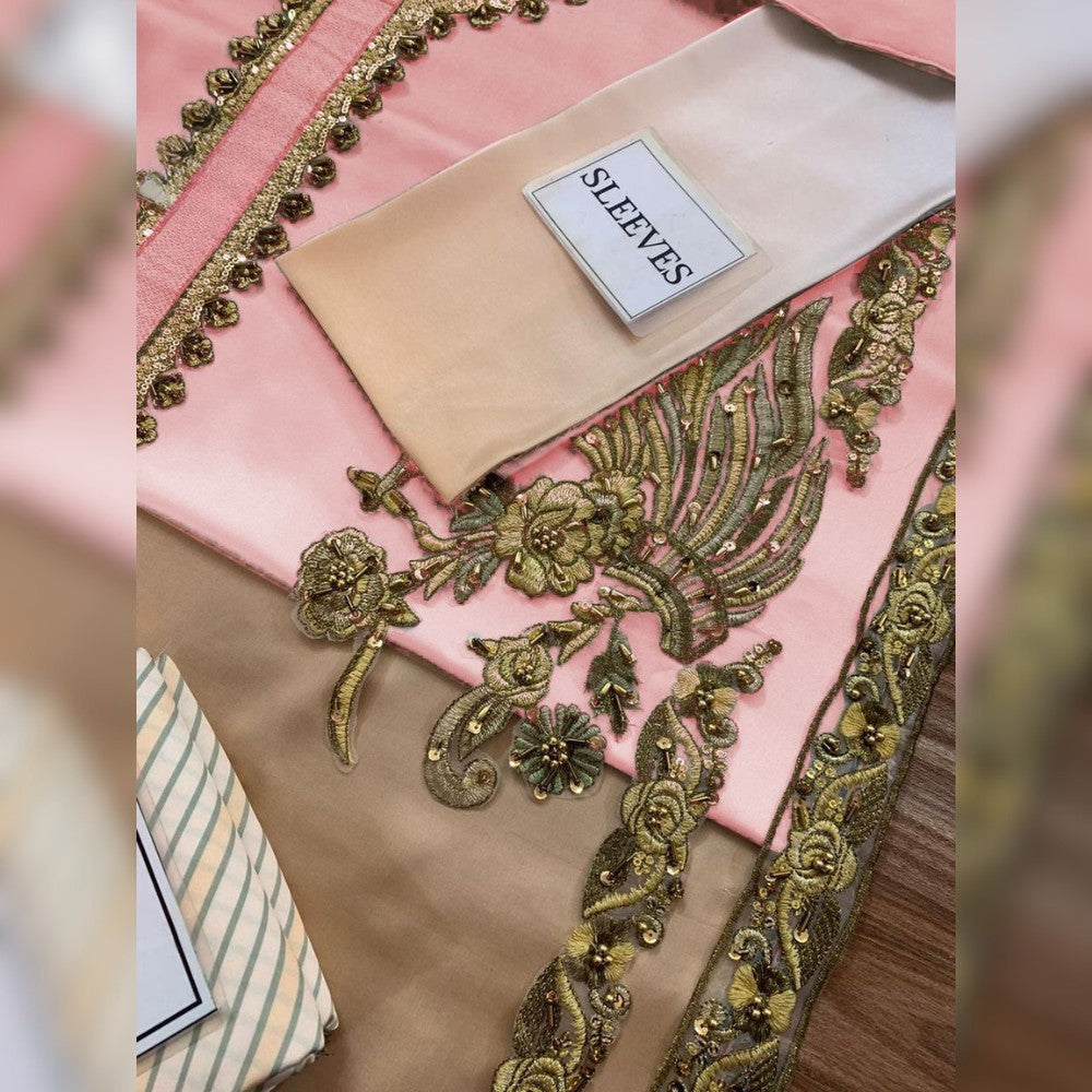 Decorative fabric with gold embroidery on a pink background, labeled 'SLEEVES'.