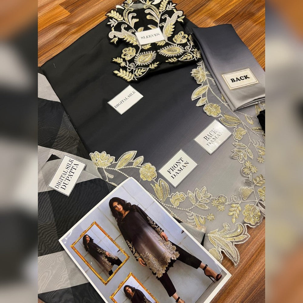 Black and gold patterned fabric with name tags and a photo of a woman on a wooden surface.