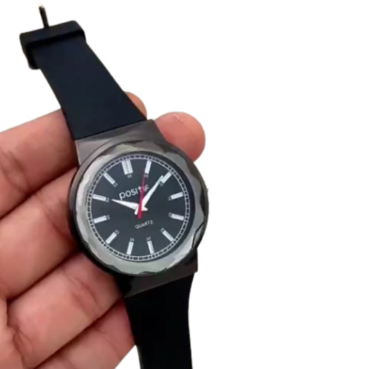 Hand holding a black wristwatch with a white face on a white background