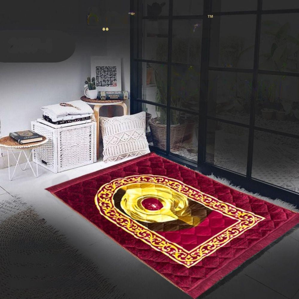 Red prayer mat with gold design in a room setting