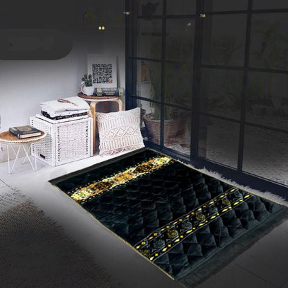 Decorative black and gold rug in a room with furniture and decor.