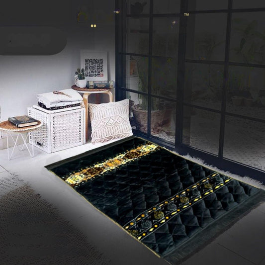 Decorative black and gold rug in a room with furniture and decor.