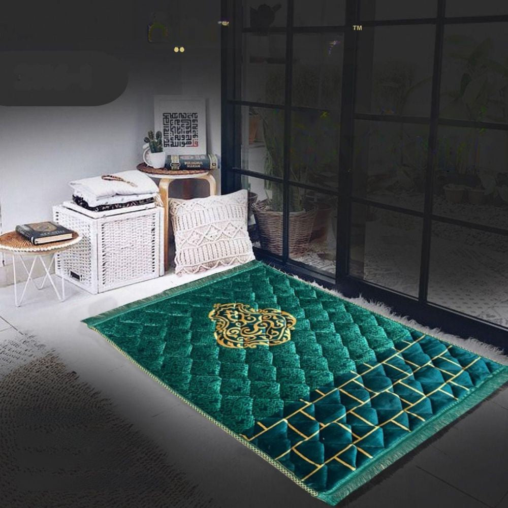 Green prayer mat with gold design in a room setting