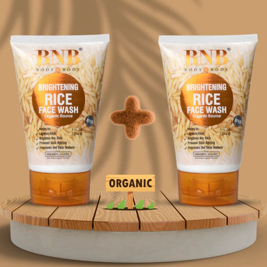 Two bottles of RNB Brightening Rice Face Wash on a wooden platform with a brown background.