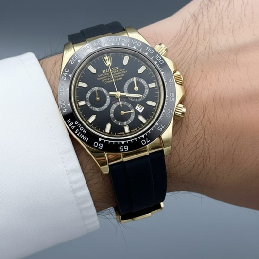 Gold and black watch on a wrist with a blurred background