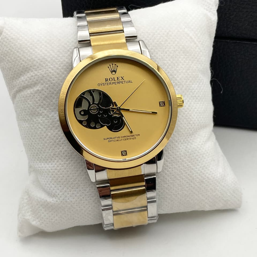 Gold and silver Rolex watch on a white cushion