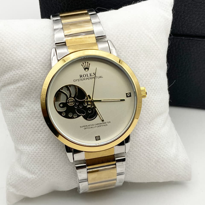Rolex watch with gold and silver band on a white cushion