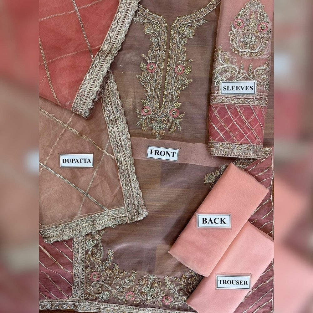 Embroidered saree set with labels indicating parts of the outfit on a blurred background.