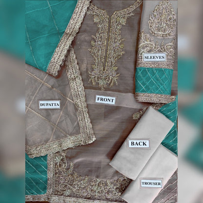 Embroidered fabric with labeled parts on a green and beige background