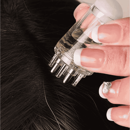 Detailed view of scalp dispenser tip and grip
