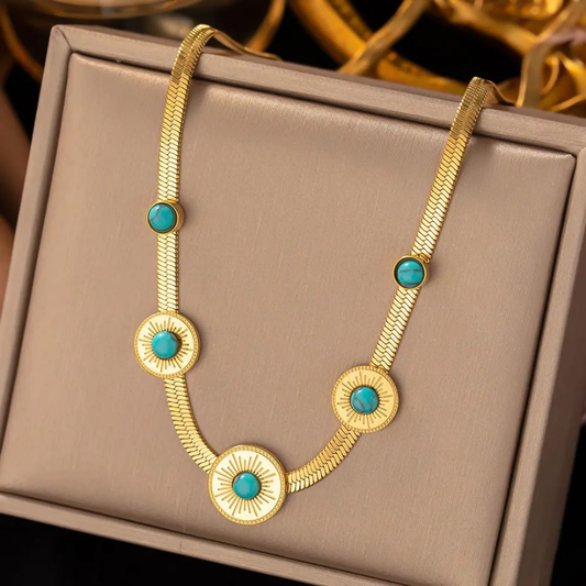 Elegant golden locket with sea green stone – right side view