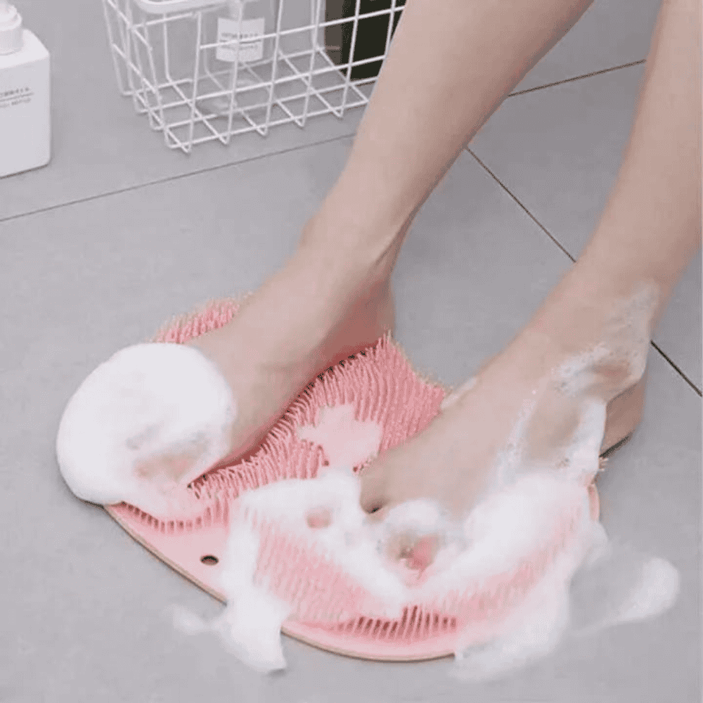 Silicone bath mat in use, demonstrating foot scrubbing functionality