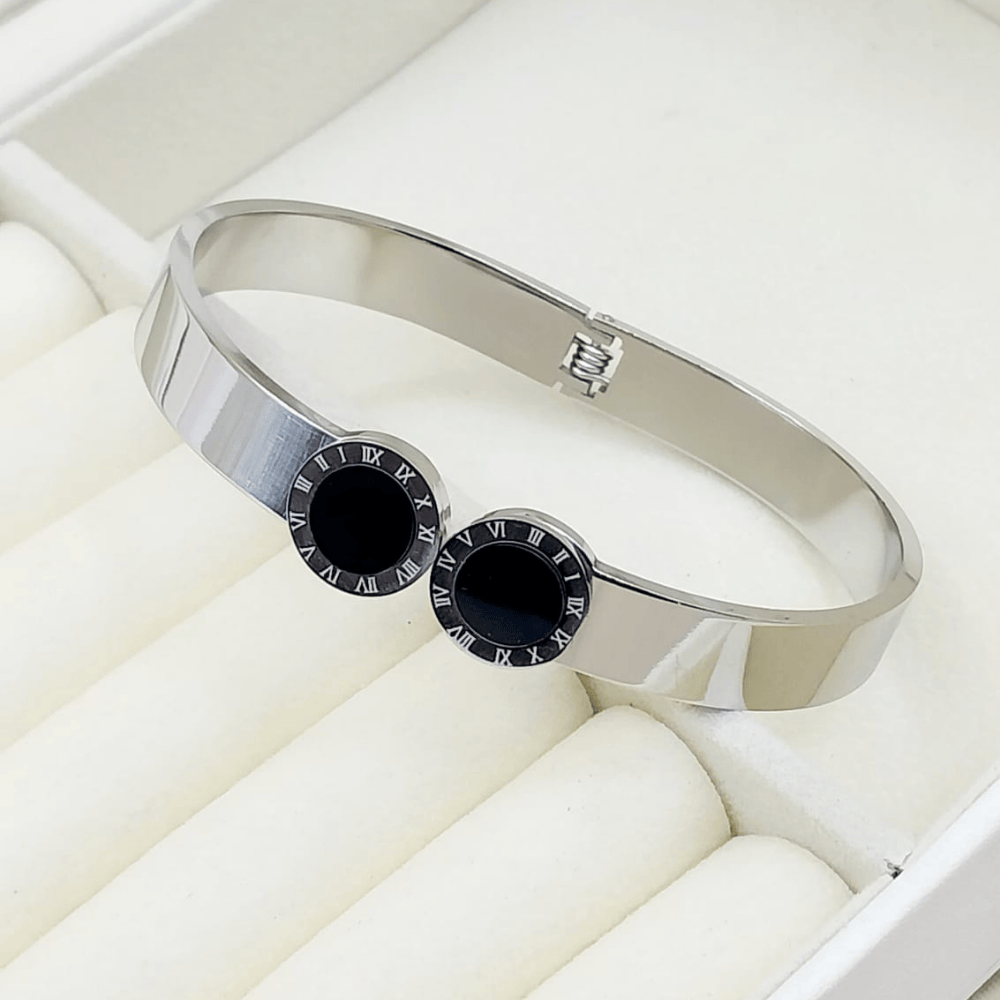 Silver bangle with black stones on both sides