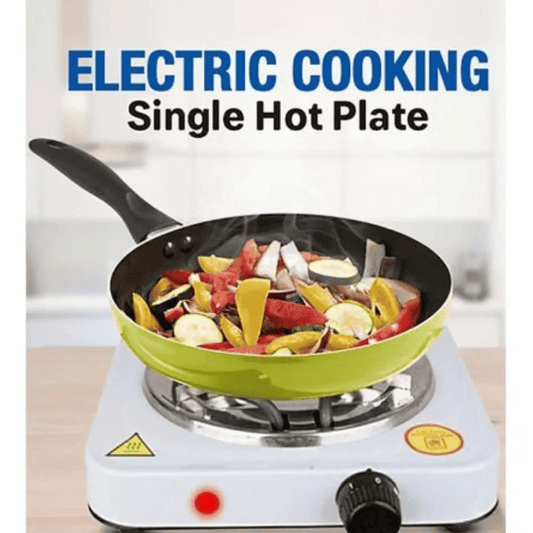Single hot plate with a frying pan containing vegetables on a white background